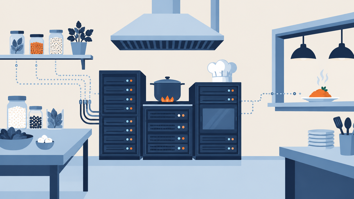 A restaurant kitchen where the stove and ovens are navy server racks, with a chef hat on top and an orange dish at the serving window, on a cream background.